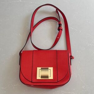 Chic Red/orange Crossbody Bag with Gold Accent